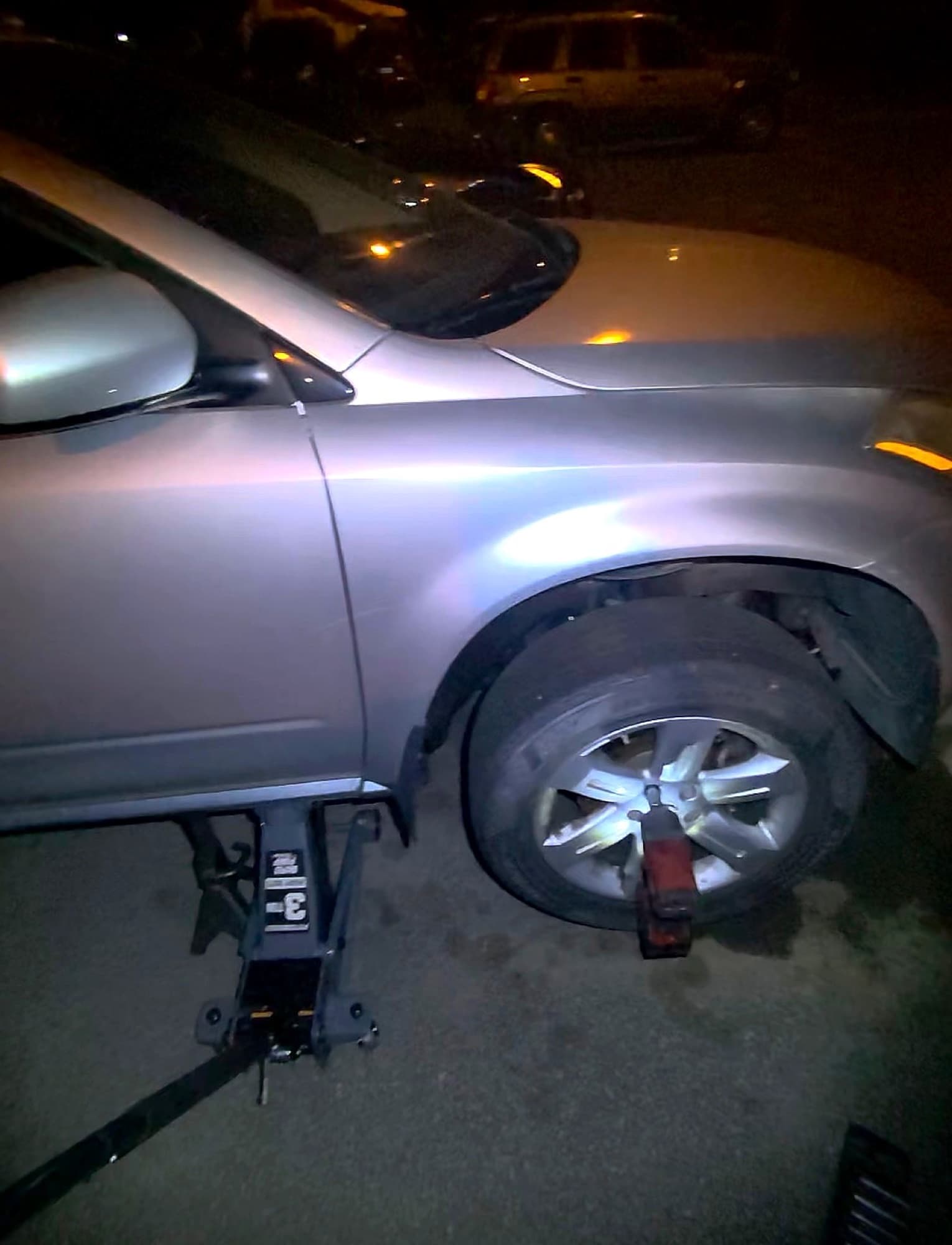 A vehicle lifted for an on-site repair